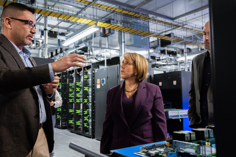 man and woman having discussion in data center room